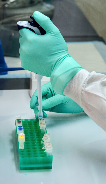 MPS researcher fills vials for clinical trials